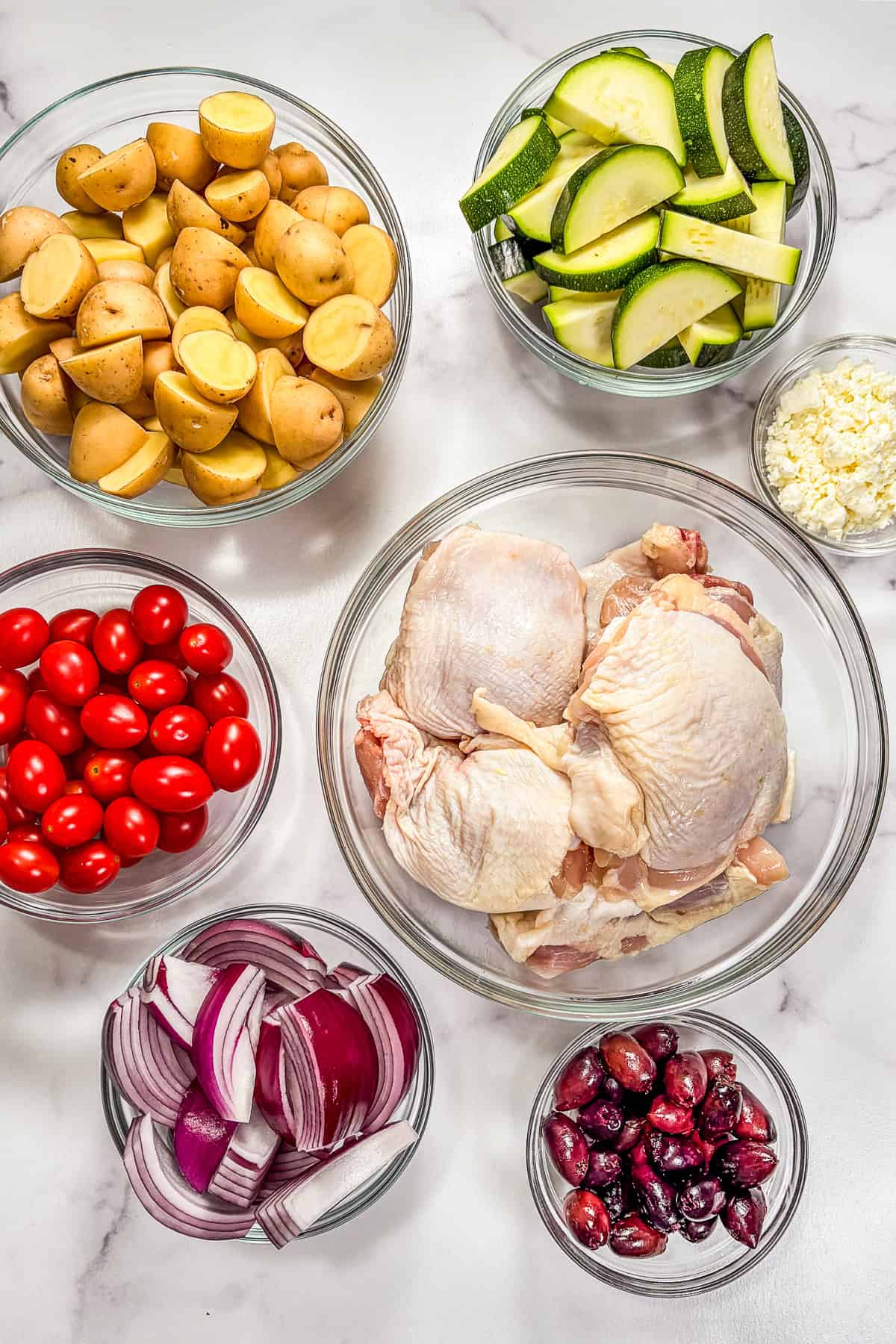 Ingredients for sheet pan Greek chicken thighs.